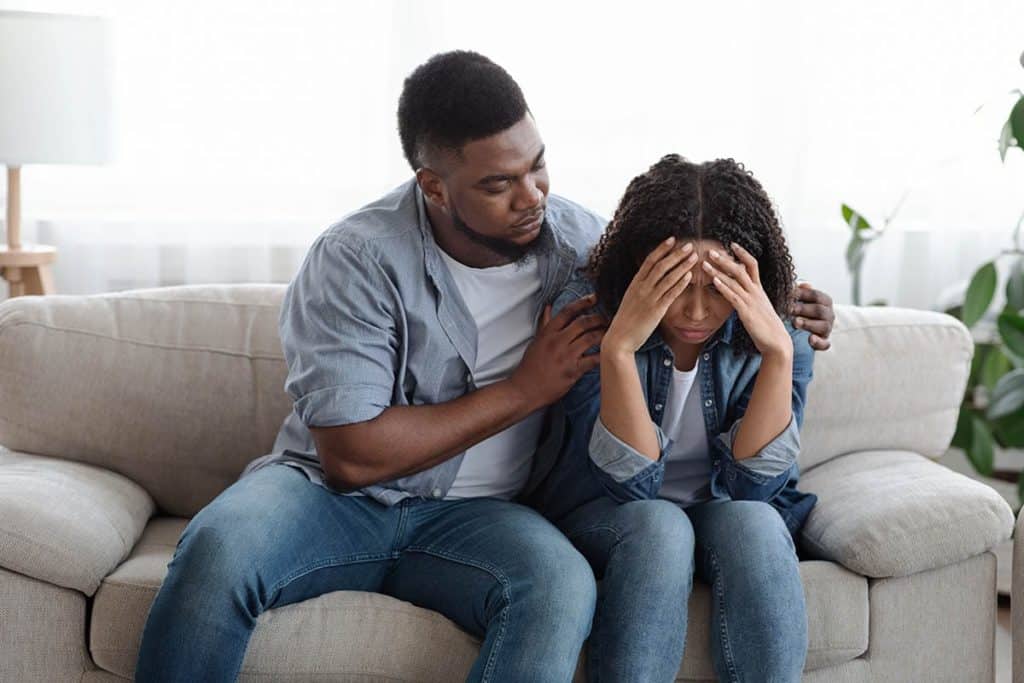 a person holds another after recognizing signs to get sober