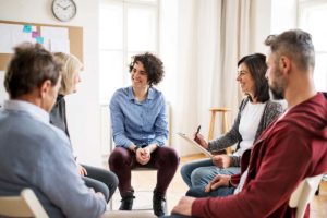 a therapy group discusses Cannabis Use Disorder