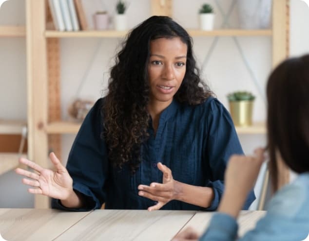 woman discussing an outpatient treatment program with therapist