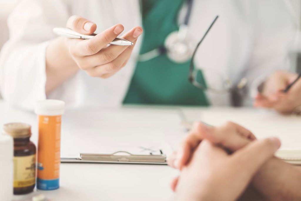 a doctor explains the differences between klonopin and xanax to a patient