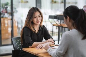 Two people discussing ways to stop enabling an addict