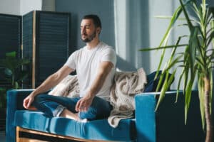 a young man enjoys the benefits of meditative therapy