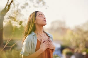 a woman calms her anxiety by taking a walk outside