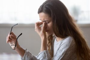 woman thinking about common medical problems that come with addiction