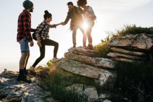 Several people in outdoor group therapy activities